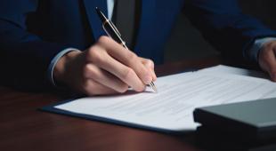 business person filling out paperwork