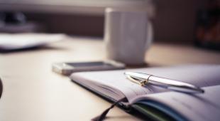 desk with pen and cup