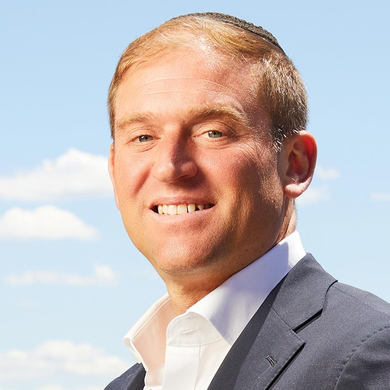 a man with the sky behind him
