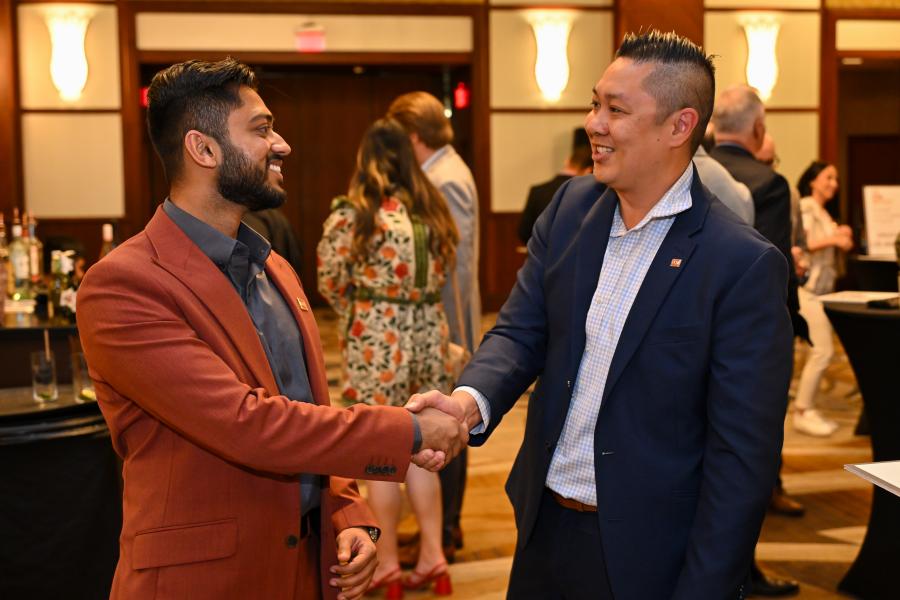 Two Designees shaking hands