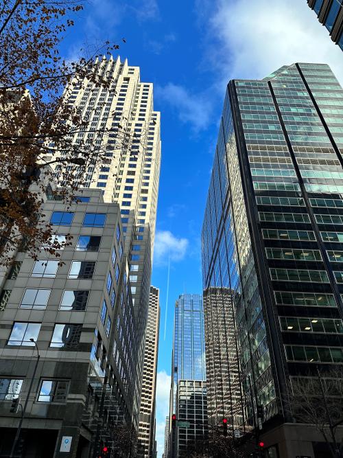 commercial buildings with blue sky and clouds