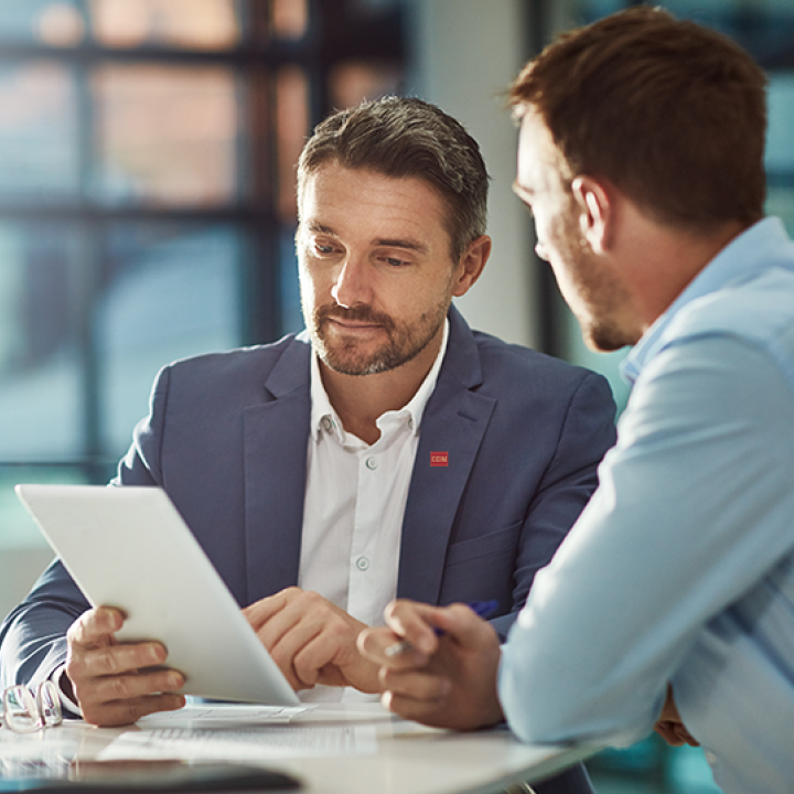 Two men executing a business deal
