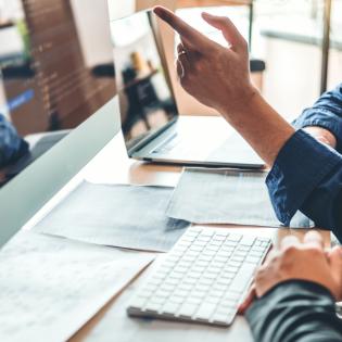 business desk with computer
