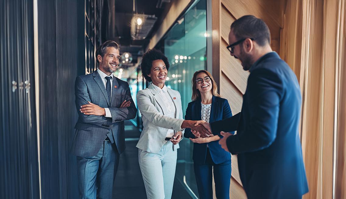Group of professionals shaking hands